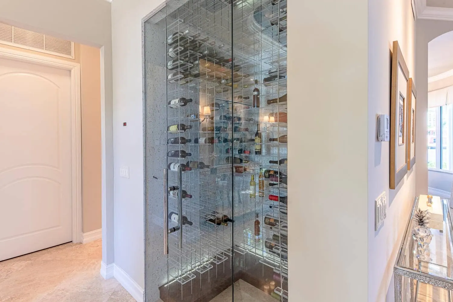 A Real Dream On The Intracoastal, Wine room by Kathryn Interiors