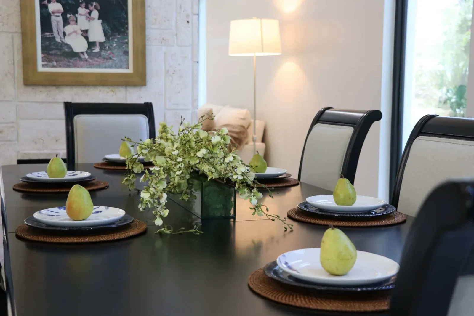 An elegant dining room with a centerpiece and sophisticated decoration
