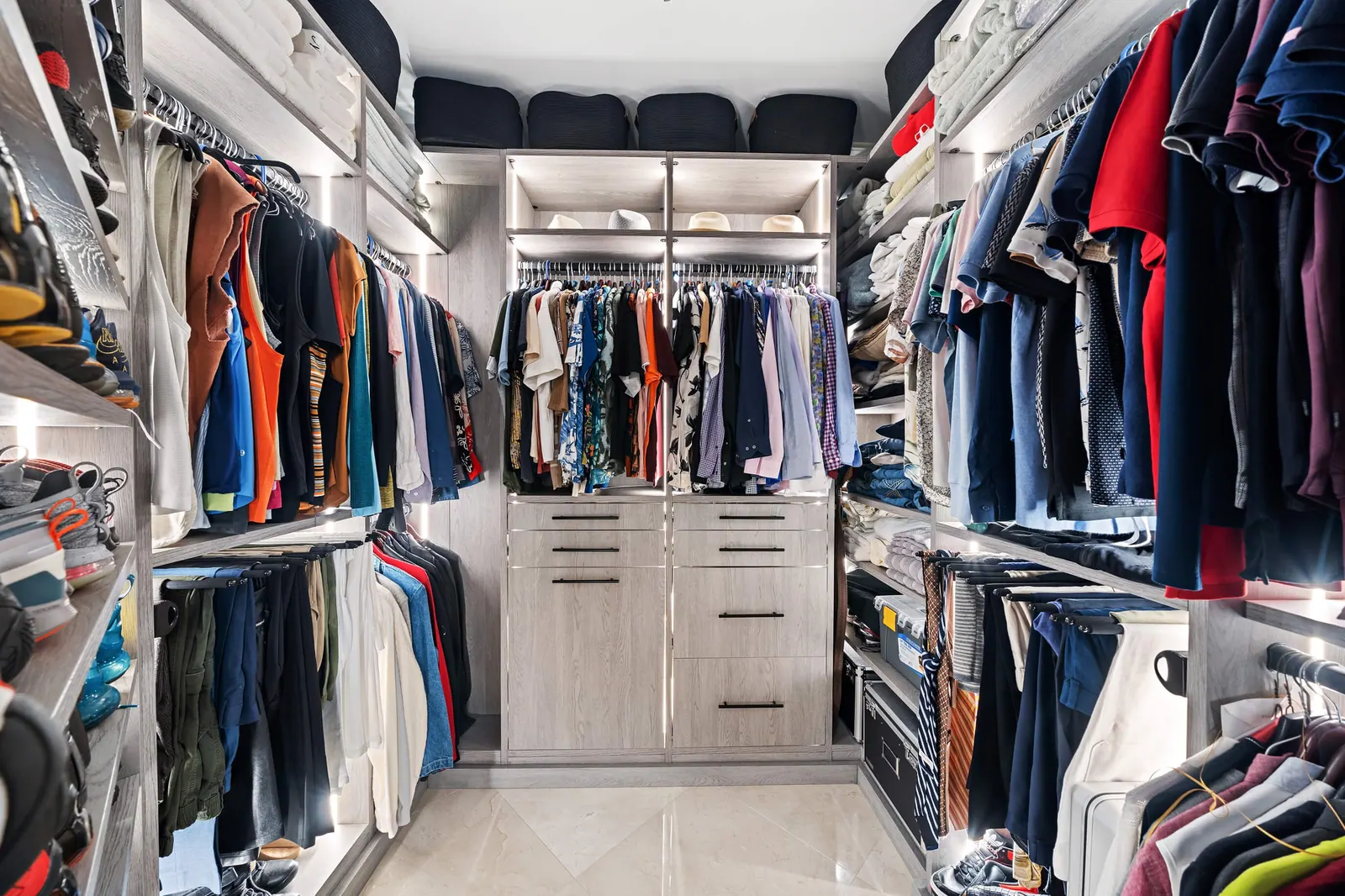 Sky-High Brickell Condo, Primary closet by Kathryn Interiors