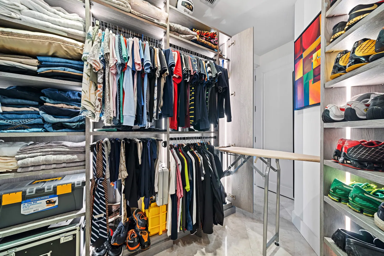 Sky-High Brickell Condo, Primary closet by Kathryn Interiors