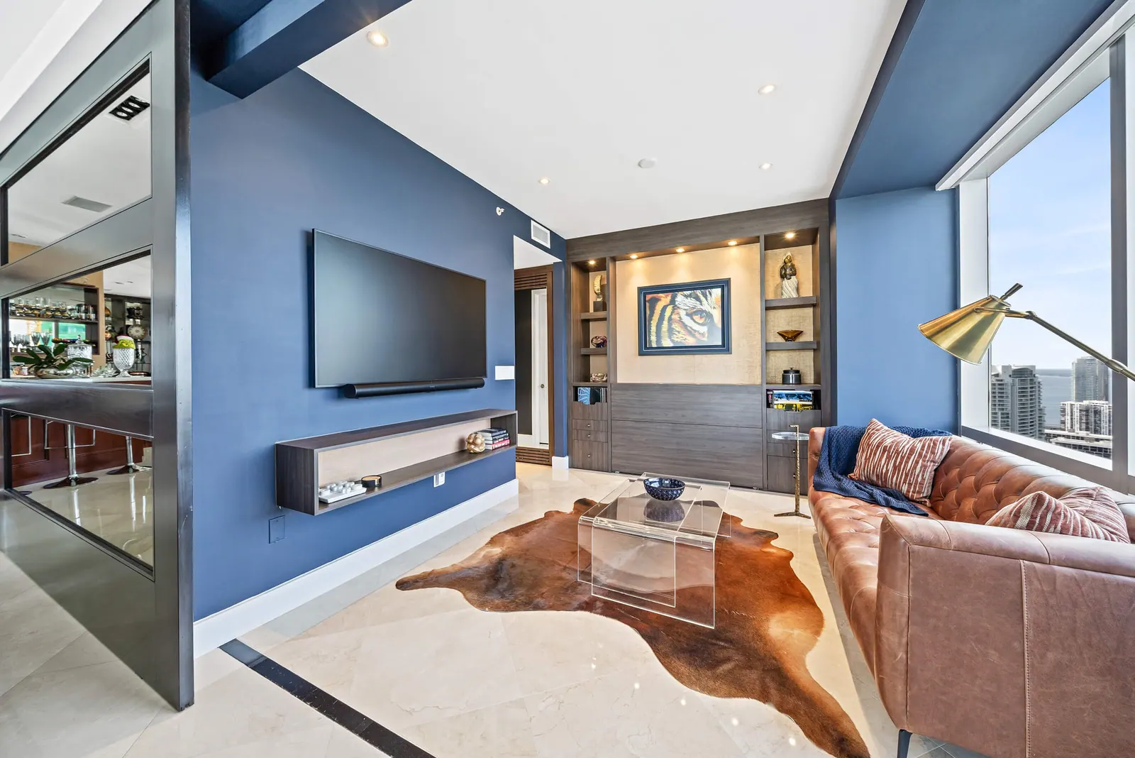 Sky-High Brickell Condo, Den by Kathryn Interiors
