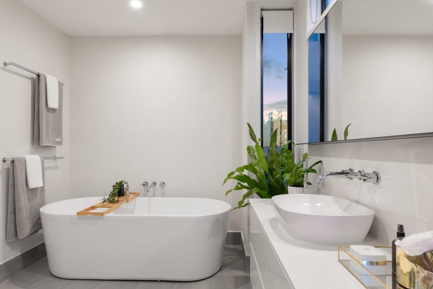 Minimalistic white and clean bathroom with plants