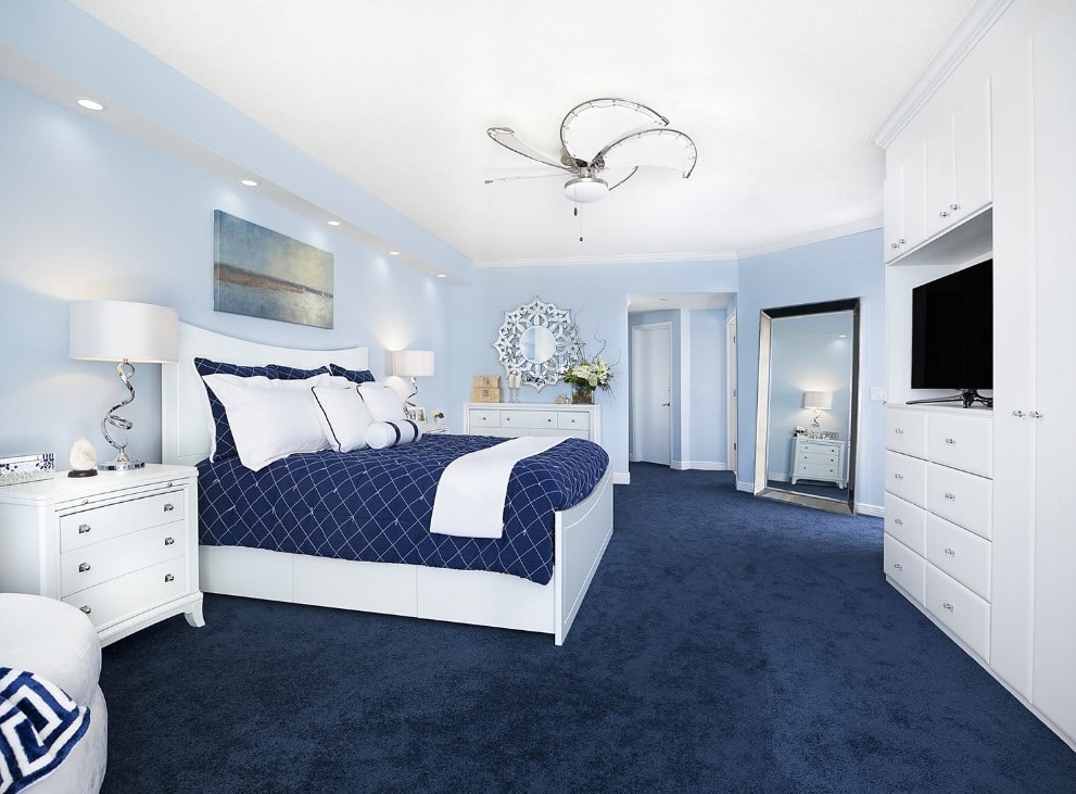 Coastal master bedroom in blue and white