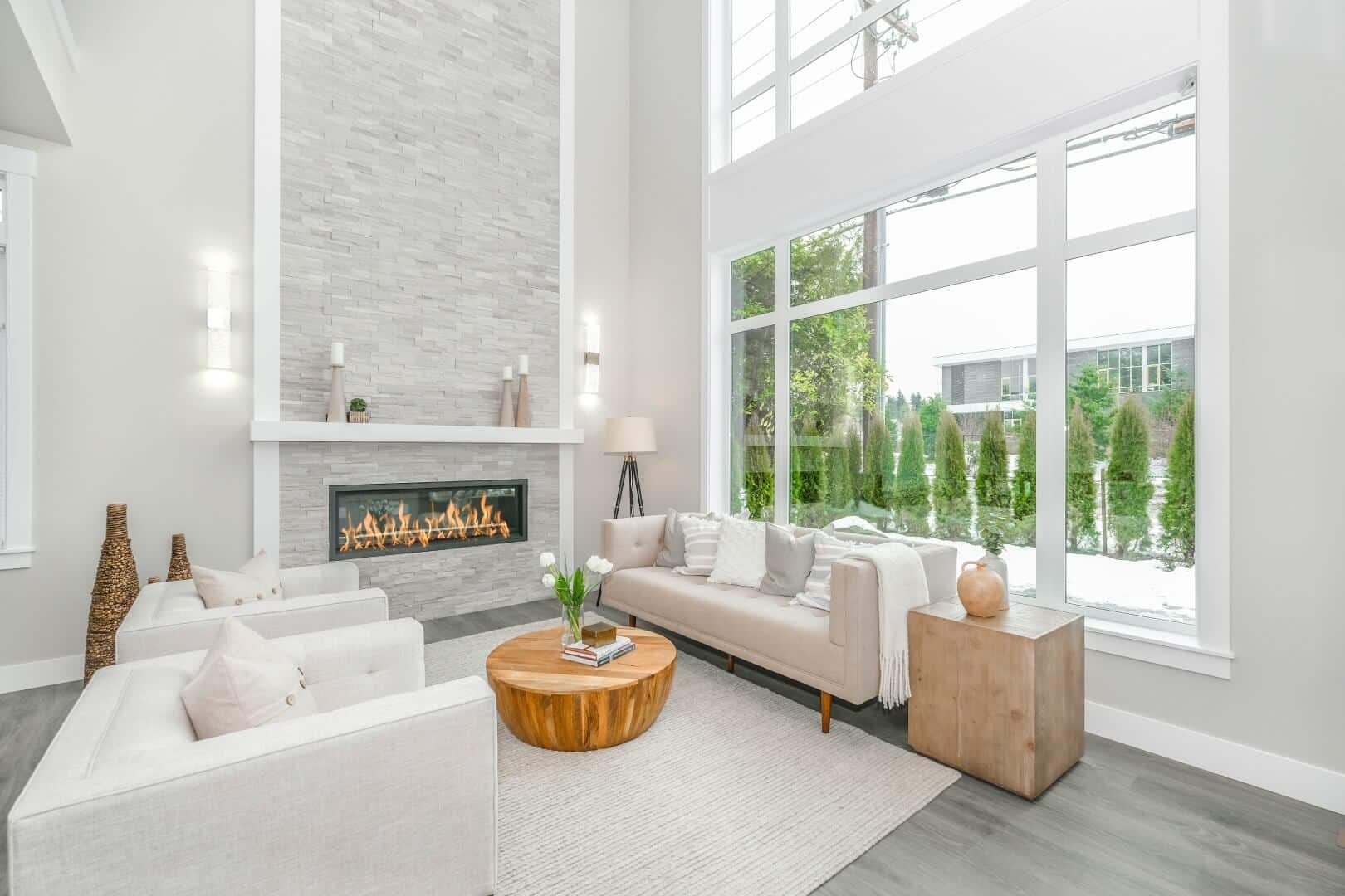 Very bright and white living room with big windows